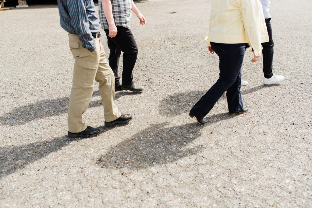 new manufactured home owners walk toward their site for inspection during the manufactured home buying process