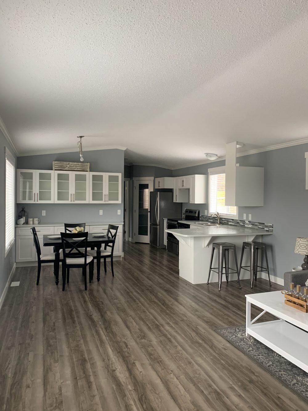 large open concept living room and kitchen in a large single wide manufactured home in salmon arm bc