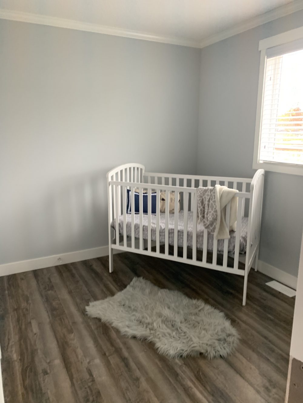 small bedroom with a crib in it as part of the kelowna showhome at countryside homes