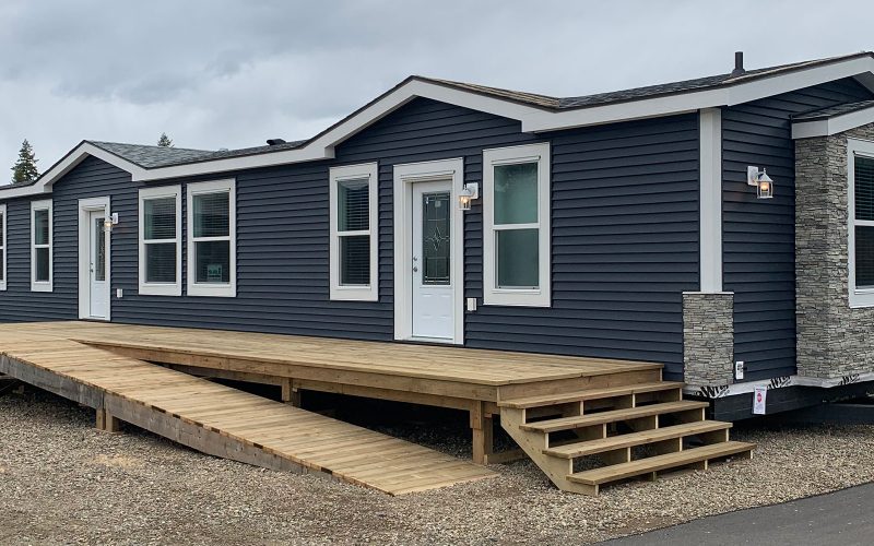 exterior dark blue with white trim of the logan manufactured home located at countryside manufactured homes in Kamloops
