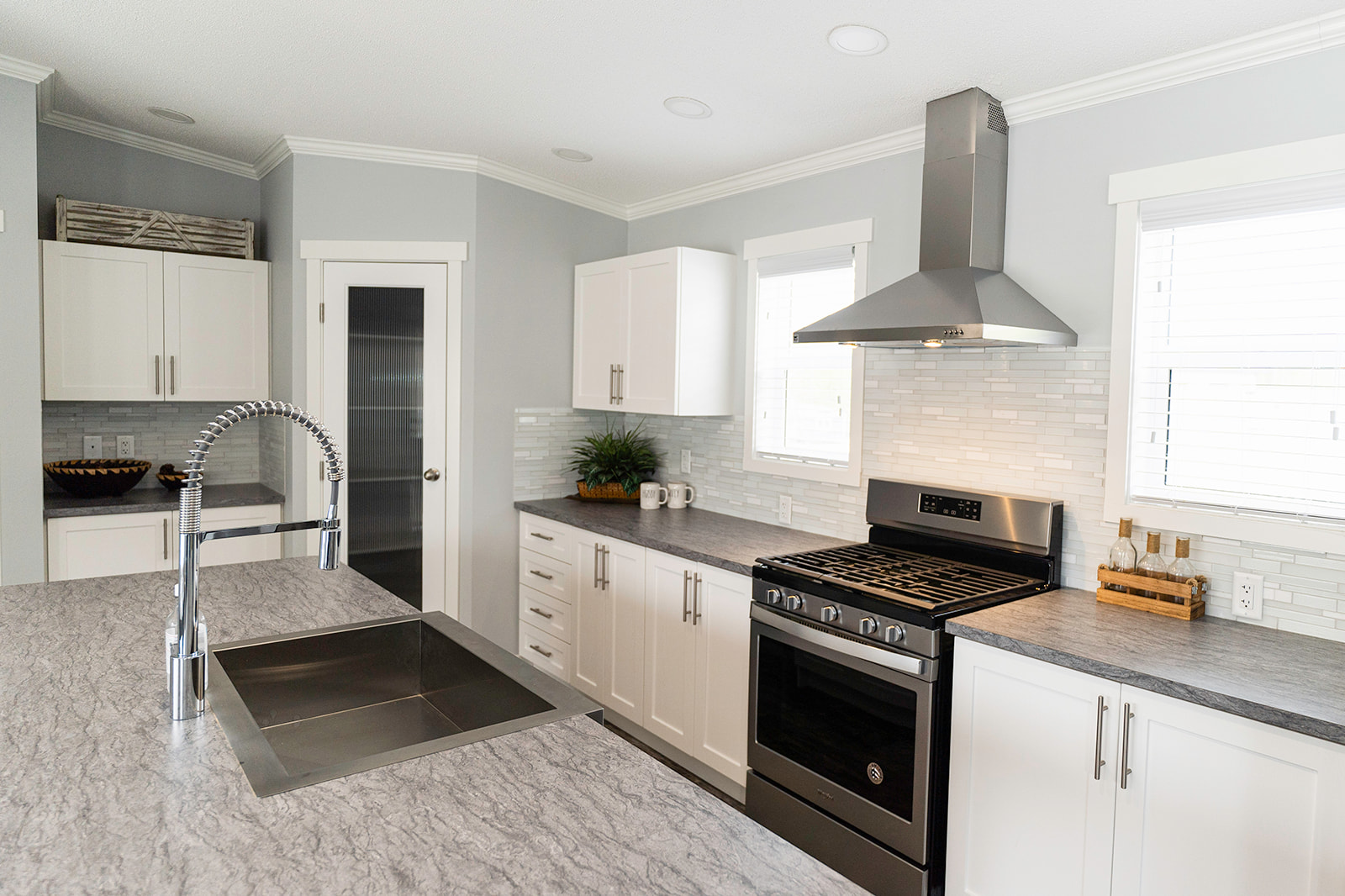 open concept kitchen with an island sink in a large modular home built by countryside homes in kamloops bc