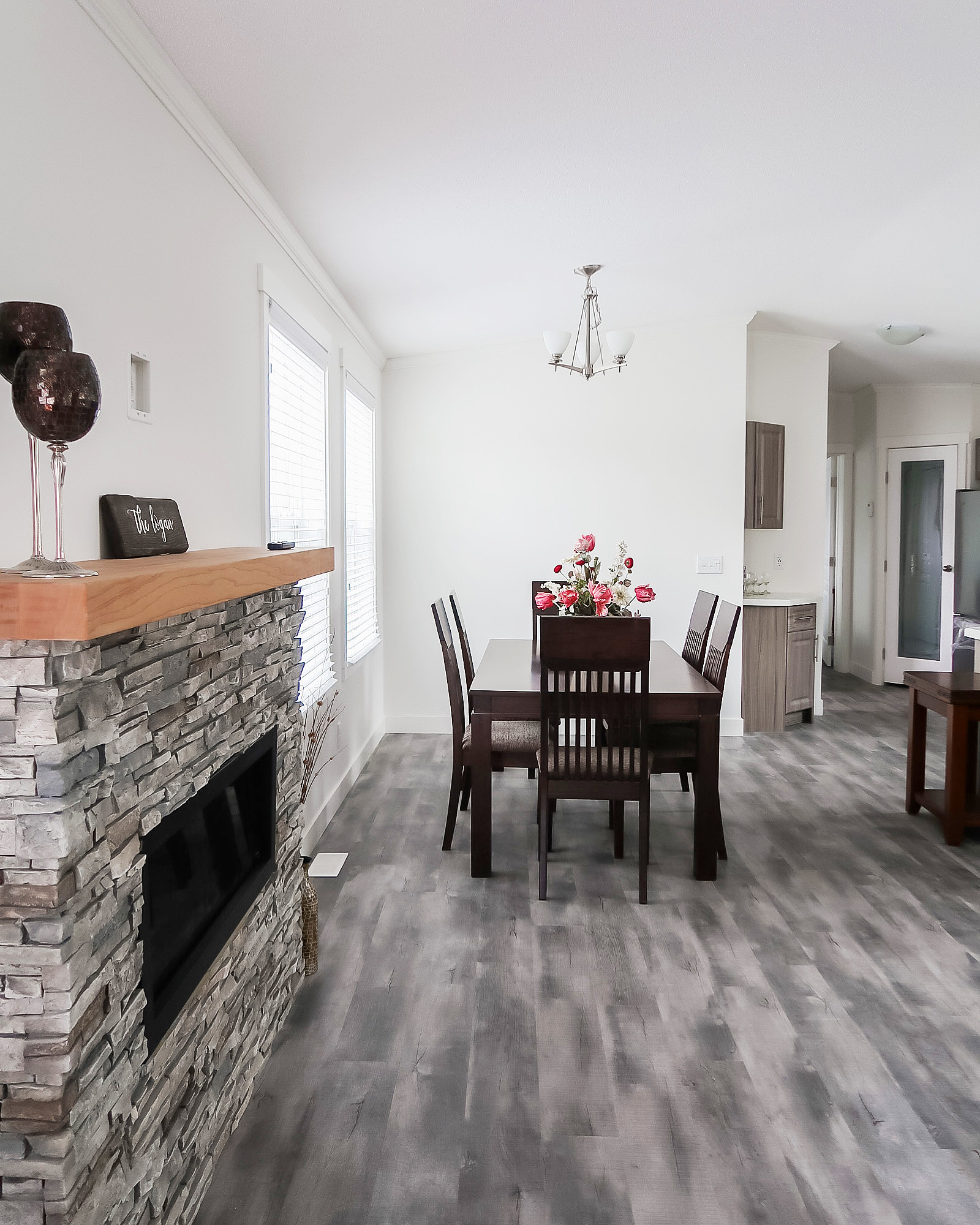 view of the dining room and kitchen of the Logan showhome built by countryside manufactured homes