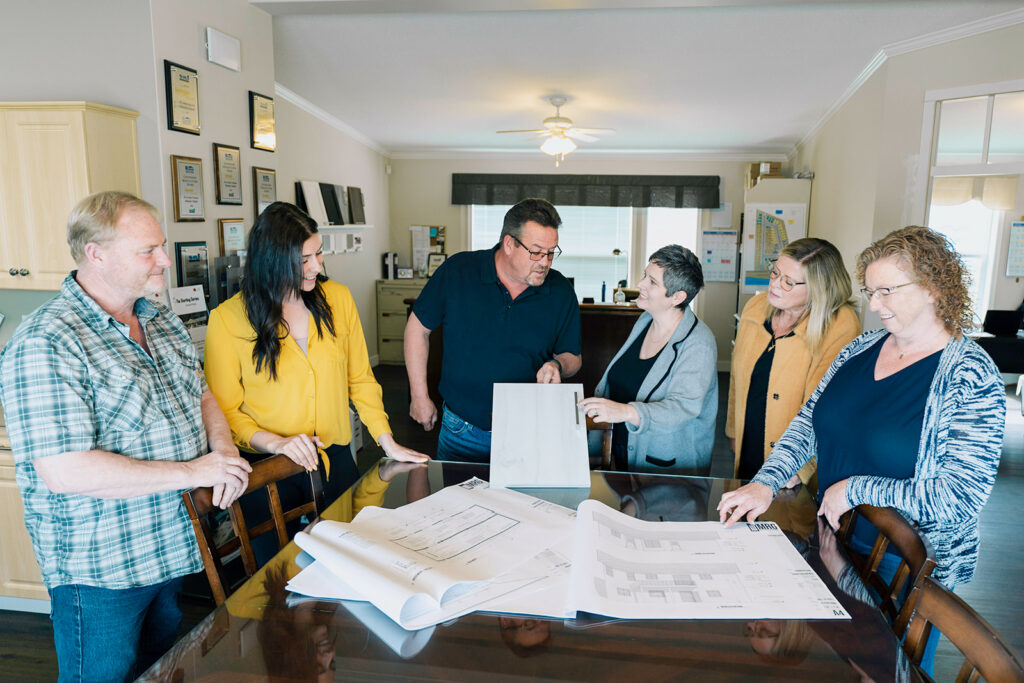 The Countryside Manufactured Homes team having a meeting for their family owned and operated business in BC