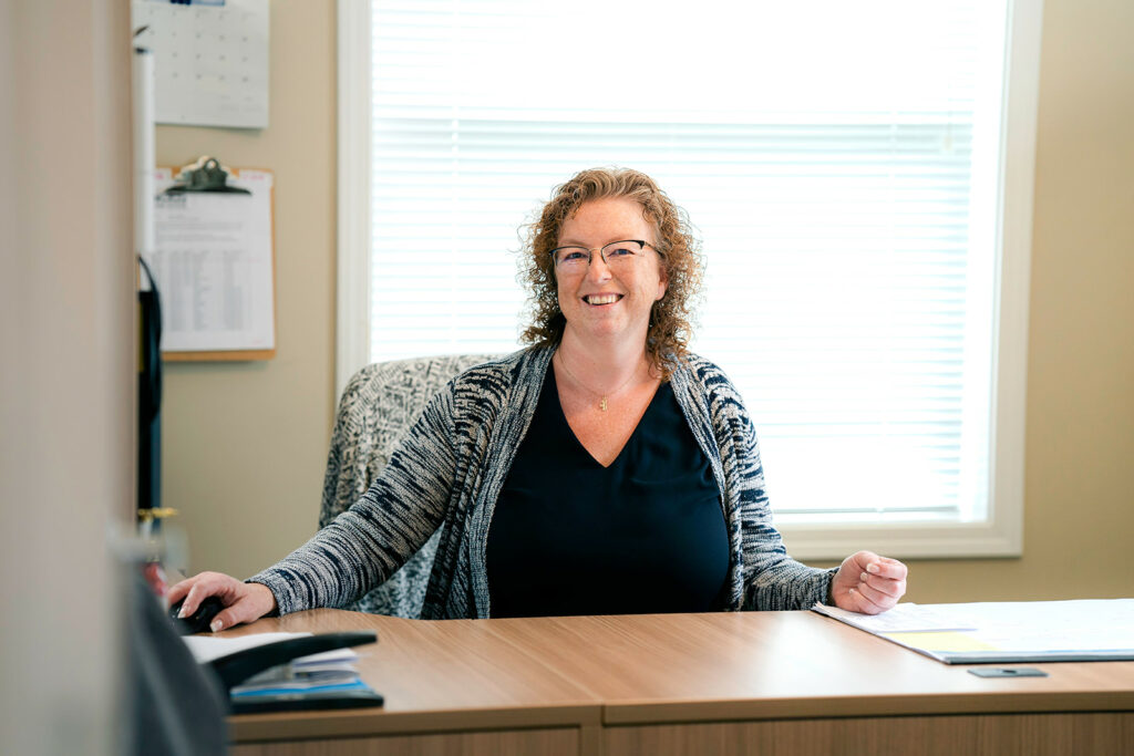 Bookkeeper Shannon working hard at her desk behind the scenes of the family-oriented business to keep everything running smoothly